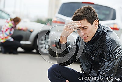 Upset man after car crash Stock Photo