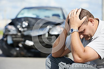 Upset man after car crash Stock Photo