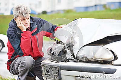 Upset man after car crash Stock Photo