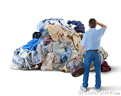 Upset man w laundry basket & huge pile of clothes Stock Photo