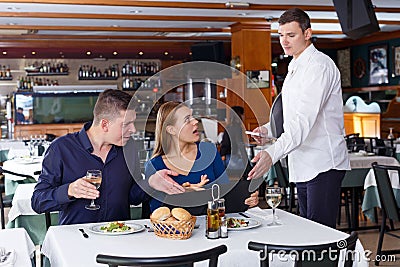 Couple dissatisfied with service of restaurant Stock Photo