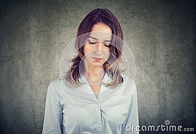 Upset pretty woman looking lonely Stock Photo