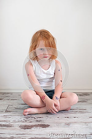 Upset redhead girl Stock Photo