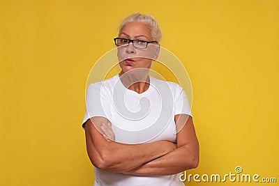 Upset senior woman lost in thoughts, miss old days, thinking or pondering Stock Photo