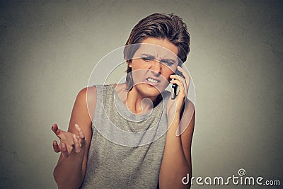 Upset skeptical, unhappy angry woman talking on phone Stock Photo