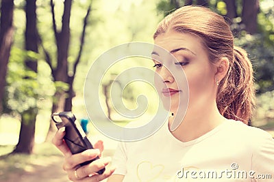 Upset skeptical unhappy serious woman talking texting on phone Stock Photo