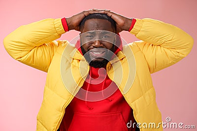 Upset unhappy african-american male entrepreneur lose money feel regret sadness grimacing painful heartbreaking feelings Stock Photo
