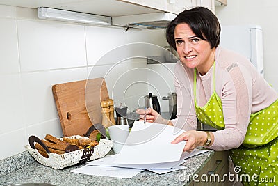 Upset woman reading bank documents Stock Photo