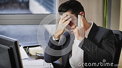 Upset, worried business on phone in office Stock Photo