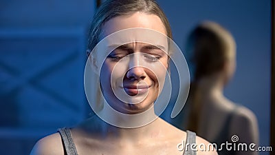 Upset young lady crying, domestic violence victim, puberty age depression, abuse Stock Photo