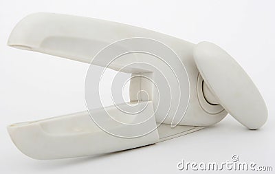 Upside down plastic tin opener with metal blades Stock Photo