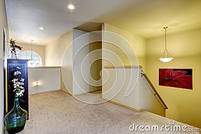 Upstairs hallway with cabinet and glass vase Stock Photo