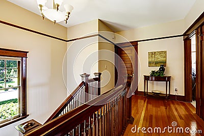 Upstairs hallway with hardwood floor and staircase Stock Photo