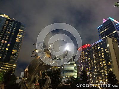 Uptown Charlotte Stormy Skies art Romare Park clouds dark over high rise queen city nightlife Stock Photo