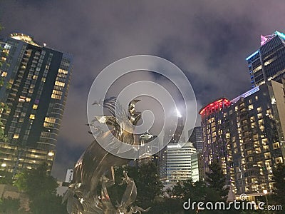 Uptown Charlotte Stormy Skies art Romare Park clouds dark over high rise queen city nightlife Stock Photo