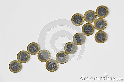 Upward arrow made of euro coins on white background - Concept of upward trend of euro currency Stock Photo