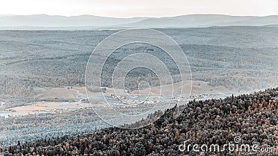 Ural Taiga against the backdrop of distant mountain peaks Stock Photo