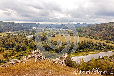 Ural village among the mountain peaks Stock Photo