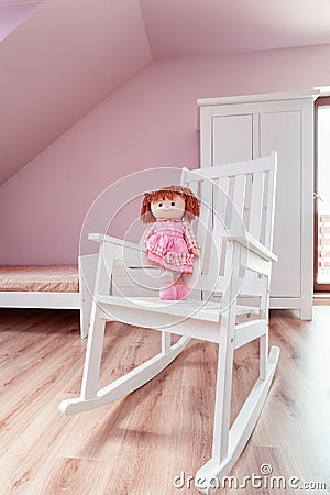 Urban apartment - doll on rocking chair Stock Photo