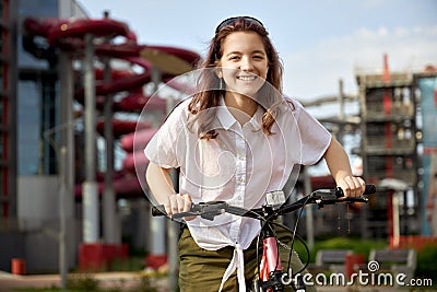 Urban biking teenage girl, bike in city Stock Photo