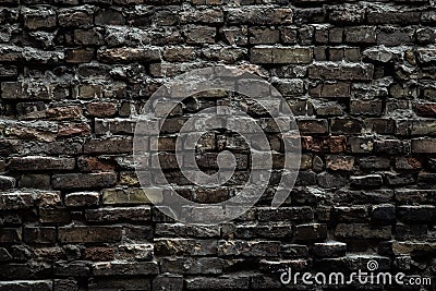 Urban black brick wall texture old masonry background. Gloomy background, black brick wall of dark stone texture Stock Photo