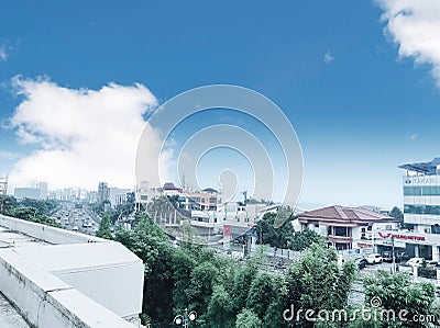 Urban city in the rooftop hotel building and blue sky road side Stock Photo