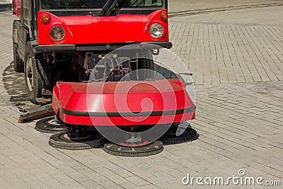 Urban cleaning process. Special vehicle washes city street or park. Ecology and pure air in modern megalopolis concept. Technology Stock Photo