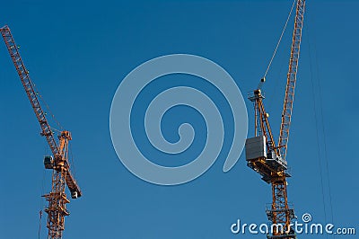 Urban construction site and tower cranes Stock Photo