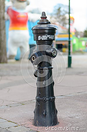 Urban fire hydrant on paving Stock Photo