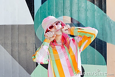 Urban Fresh street fashion look. Vanilla Girl. Kawaii vibes. Candy colors design. Bucket hat trends. Young woman with Stock Photo