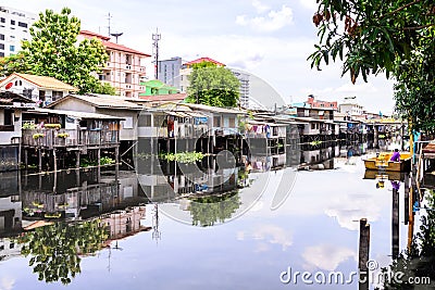 Urban ghetto house village canal side in Bangkok Thailand Stock Photo