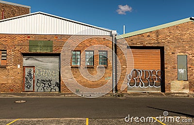 Urban graffiti on factory doors. Editorial Stock Photo