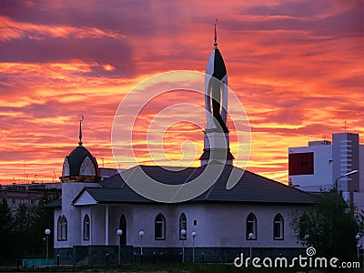 The urban landscape. Mosque at sunset. Stock Photo