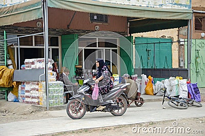 Urban life, shops and workshops, markets and common life in the streets of Morocco. People walking around Editorial Stock Photo