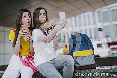 Two female friends making selfie with hot dogs Stock Photo