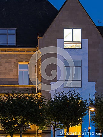 Urban lights: illuminated house in Frankfurt, Germany Stock Photo