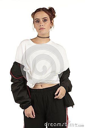 Urban model with attitude in an extra large streetwear tee and slouching tracksuit jacket large space to upload your hip-hop desig Stock Photo