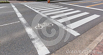 Urban pedestrian crosswalk across an asphalt road in city. Stock Photo