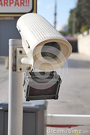 Urban security camera placements near vehicles captured in video footage Stock Photo