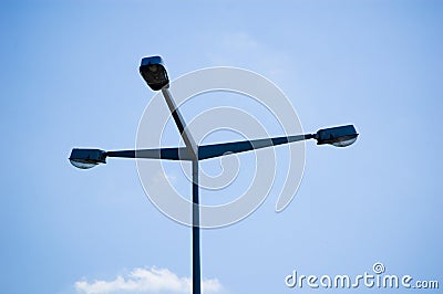 Urban street triple light against blue sky Stock Photo