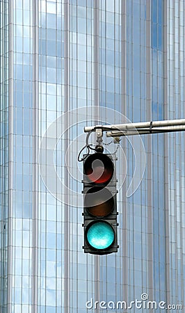 Urban traffic light on green Stock Photo