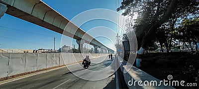 Urban Transit: A New Metro Overpass Above The Busy City Street Stock Photo