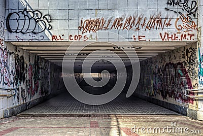 Urban underground tunnel with modern graffiti Stock Photo