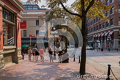 Urban view of Downtown Vancouver. Old and modern buildings, roads, commercial establishments on sunny summer day Editorial Stock Photo