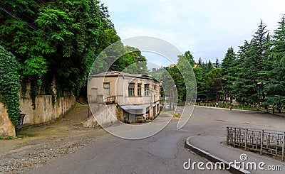Urban views and decoration of the city Chiatura , Georgia. Blue sky with clouds. River and old houses Stock Photo