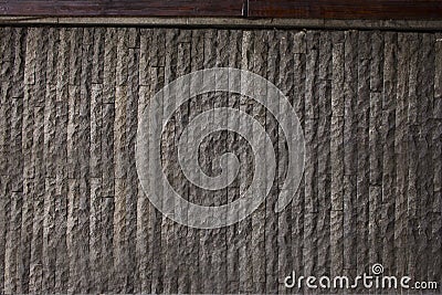 Urban wall grey rough vertical strips texture . Stock Photo