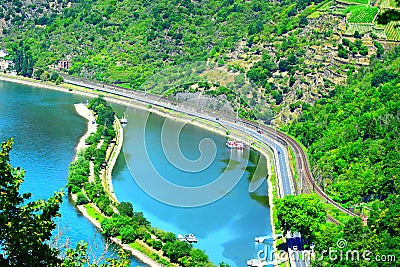 Urbar, Germany - 07 22 2020: Rhine harbor, road and railroad between Loreley rock and Sankt Goarshausen Editorial Stock Photo