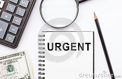 URGENT. A note in a notebook for urgent matters Stock Photo