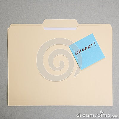 Urgent sticky note. Stock Photo