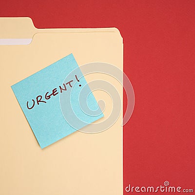 Urgent sticky note. Stock Photo